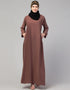 Trendy Abaya made from Nida fabric with a flared hem for a feminine touch In Color Light brown